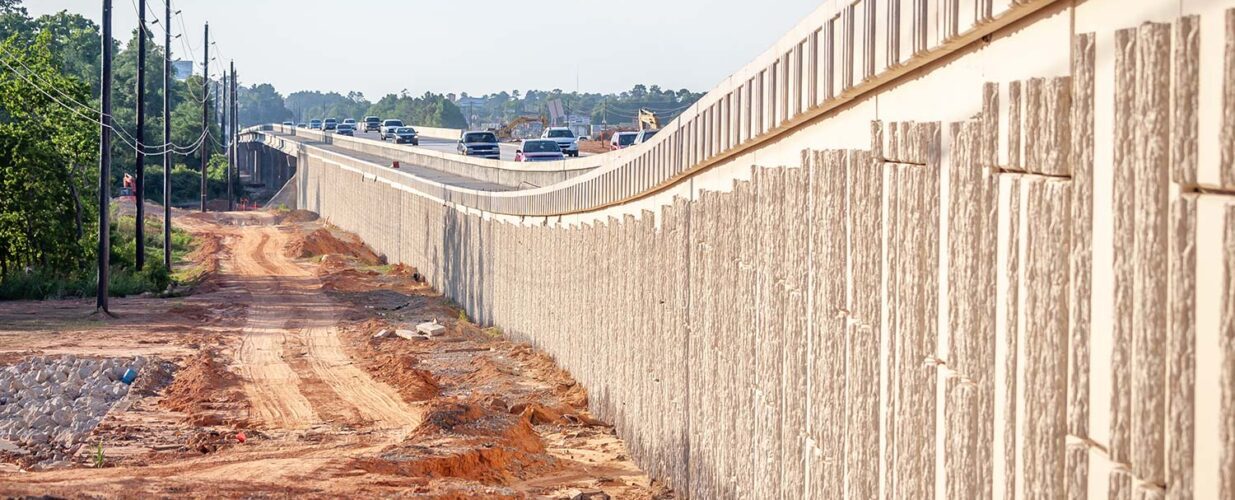 side view of rampway concrete wall Tomball Tollway