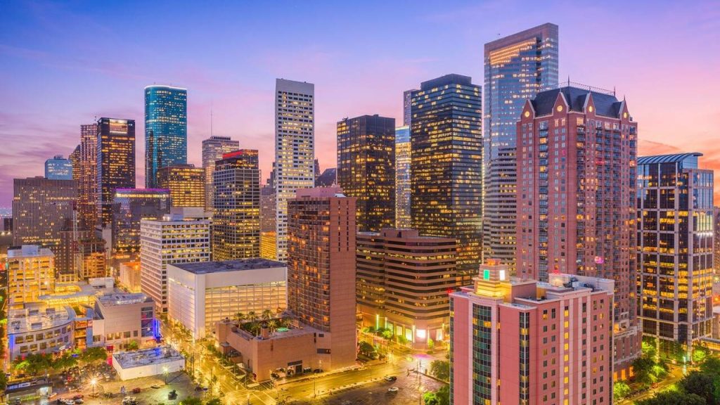 Puple and orange downtown city skyline at sunset in Houston, Texas, the "Energy Capital of the World"